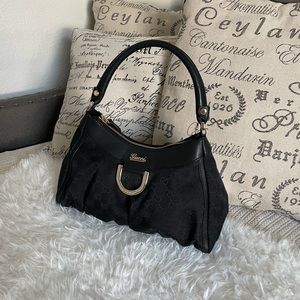 Authentic Gucci D Ring Hobo GG Canvas Small in black.